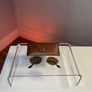 Golden lens Ray Ban oval sunglasses.